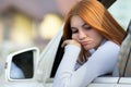 Sad woman driver looking out of a car window Royalty Free Stock Photo