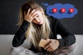 Sad woman feeling left alone on social media Royalty Free Stock Photo