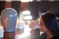 Sad woman with funerary urn praying at church Royalty Free Stock Photo