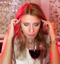 Sad woman with glass of red wine Royalty Free Stock Photo