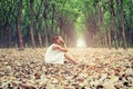 Sad woman hands off her face so sadly sitting on dry leaf in the