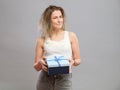 Sad woman holding gift box Royalty Free Stock Photo