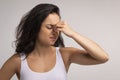 Sad woman holding his nose because sinus pain Royalty Free Stock Photo