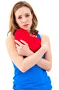 Sad woman holding red valentine heart Royalty Free Stock Photo