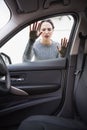 Sad woman looking inside the car Royalty Free Stock Photo