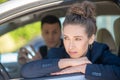 Sad woman looking out of a car window Royalty Free Stock Photo