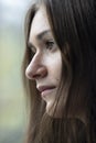 Sad woman looking out of the window Royalty Free Stock Photo