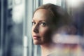 Sad woman looking out window Royalty Free Stock Photo