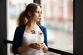 Sad woman looking out the window Royalty Free Stock Photo