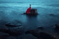 A sad woman near the sea in evening Royalty Free Stock Photo