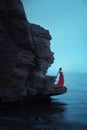 A sad woman near the sea in evening Royalty Free Stock Photo