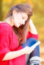 Sad woman in park with phone. Royalty Free Stock Photo