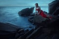 A sad woman near the sea in evening Royalty Free Stock Photo