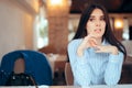 Sad Woman Removing Wedding Ring Thinking about Divorce