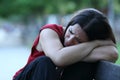 Sad woman in a park complaining on a bench Royalty Free Stock Photo