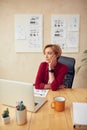 Sad Woman Sitting Office. Bored Businesswoman Looking Away At Her Workplace Royalty Free Stock Photo