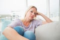 Sad woman sitting on sofa Royalty Free Stock Photo