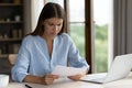 Woman read letter with bad news looks dissatisfied Royalty Free Stock Photo