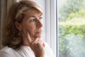 Sad Woman Suffering From Agoraphobia Looking Out Of Window Royalty Free Stock Photo