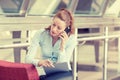 Sad woman talking on mobile phone looking down Royalty Free Stock Photo