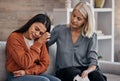 Sad woman, therapist and care for understanding in support for addiction, mental health or counseling. Female counselor Royalty Free Stock Photo