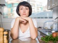 Sad woman tired of worries at kitchen Royalty Free Stock Photo