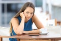 Sad woman waiting for a phone message or call Royalty Free Stock Photo