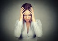 Sad woman with worried stressed face expression looking down Royalty Free Stock Photo