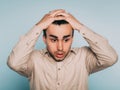 Sad worried scared afraid man pull hair out emotion Royalty Free Stock Photo