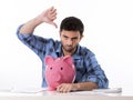 Sad worried man in stress with piggy bank in bad f