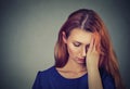 Sad young beautiful woman with worried stressed face expression looking down Royalty Free Stock Photo