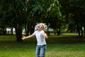 Sad young boy crying and run in nature, park, outdoor. Annoyance and sadness. Looking for support Royalty Free Stock Photo