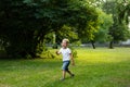 Sad young boy crying and run in nature, park, outdoor. Annoyance and sadness. Looking for support Royalty Free Stock Photo