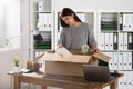 Businesswoman Packing Her Belongings In Cardboard Box Royalty Free Stock Photo