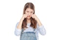 Sad young fashion girl in jeans overalls isolated Royalty Free Stock Photo