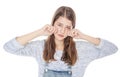 Sad young fashion girl in jeans overalls isolated Royalty Free Stock Photo