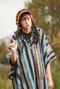 Sad young fashion hippie man walking outdoor Royalty Free Stock Photo