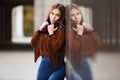 Sad young fashion woman on city street Royalty Free Stock Photo