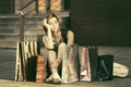 Sad young fashion woman with shopping bags sitting on the sidewalk Royalty Free Stock Photo