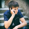 Sad Young Man with Cellphone Royalty Free Stock Photo
