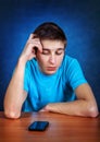 Sad Young Man with the Phone Royalty Free Stock Photo