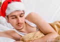 Sad Young Man in Santa Hat Royalty Free Stock Photo