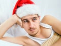 Sad Young Man in Santa Hat Royalty Free Stock Photo