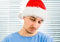 Sad Young Man in Santa Hat Royalty Free Stock Photo