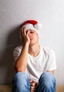 Sad Young Man in Santa Hat Royalty Free Stock Photo