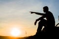 Sad young man silhouette worried on the stone Royalty Free Stock Photo