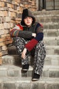 Sad young fashion man sitting on the steps Royalty Free Stock Photo