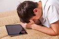 Sad Young Man with Tablet Royalty Free Stock Photo