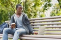 Sad young man using laptop outdoors Royalty Free Stock Photo