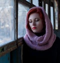 Sad young red-haired girl, a sad girl look with a scarf on her head. Sad dramatic portrait of a woman Royalty Free Stock Photo